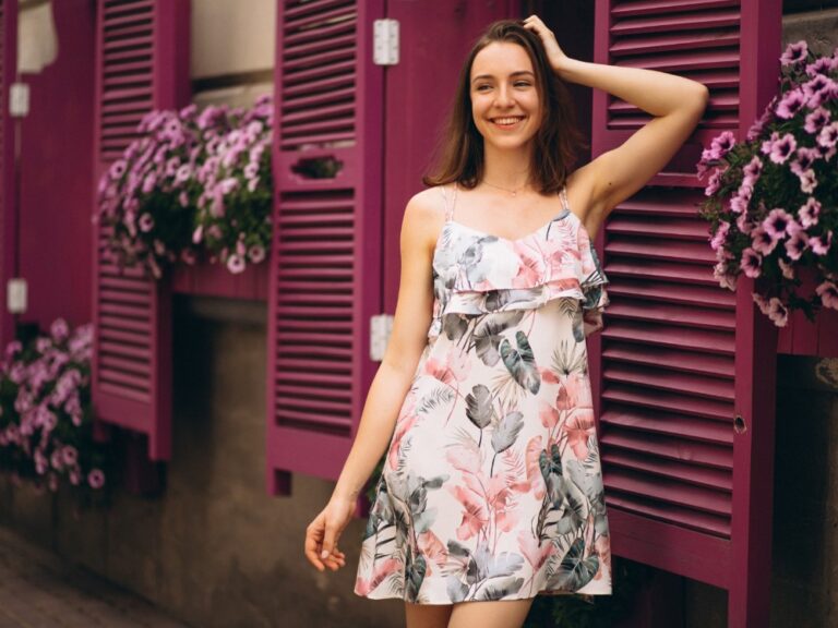 portrait-happy-woman-outside-cafe-decorated-with-flowers
